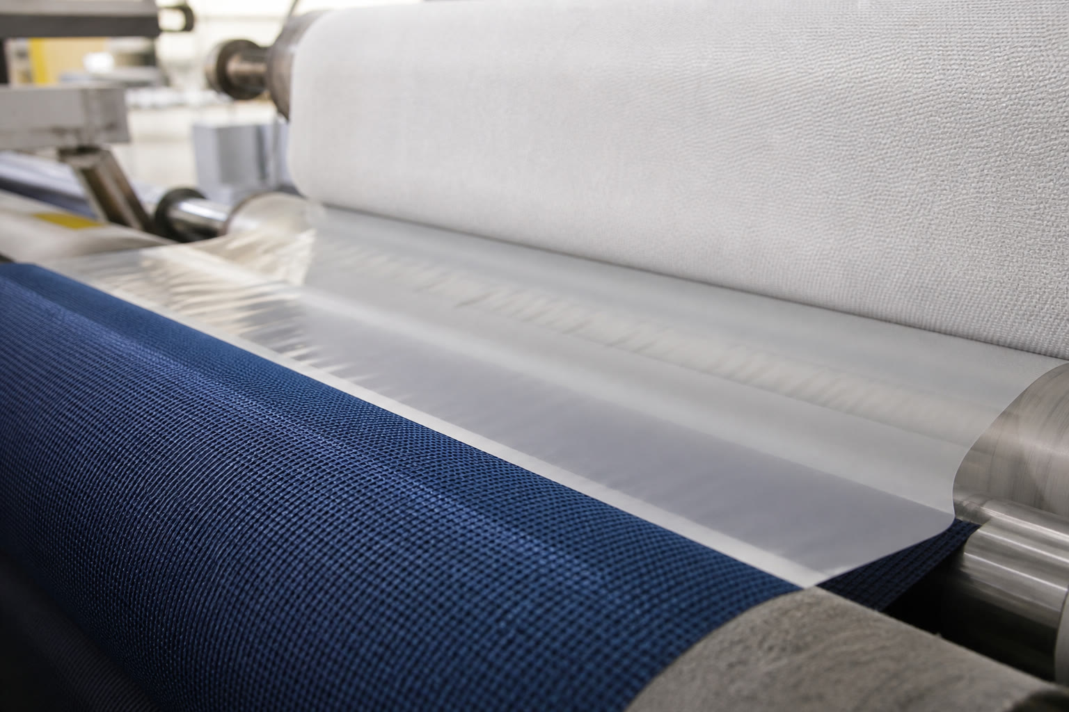 Textile lamination on a roll-to-roll line